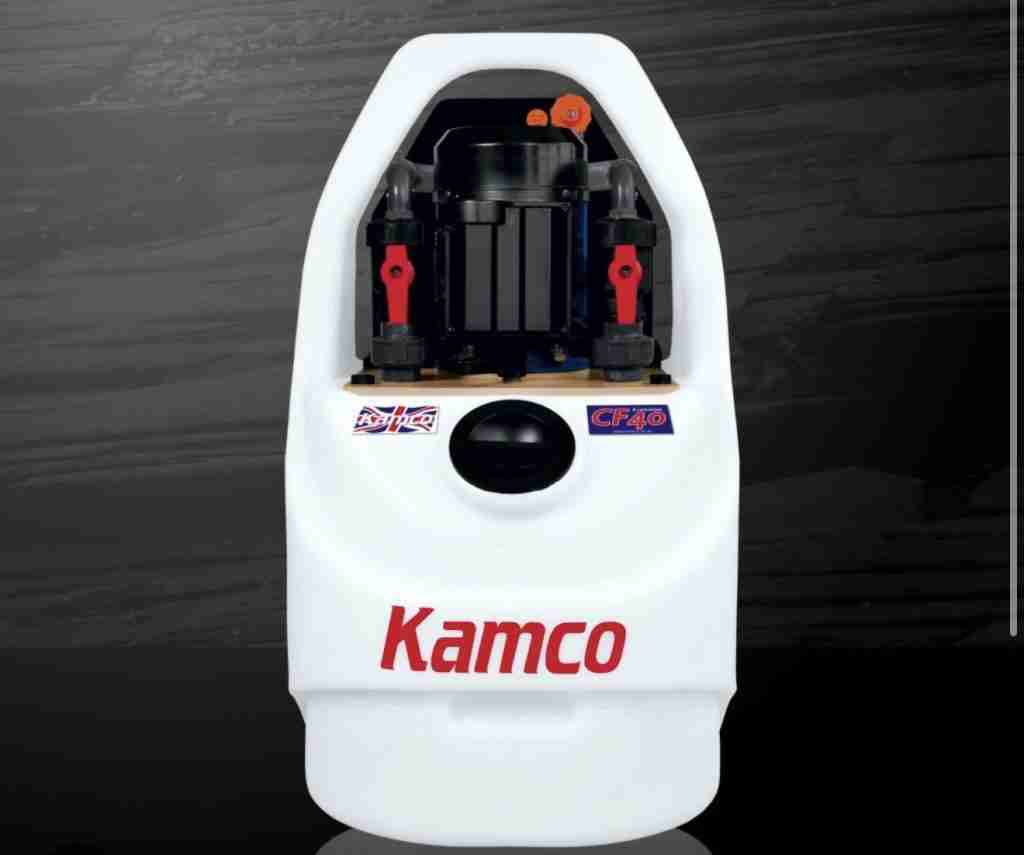 Kamco powerflushing machine removing sludge from central heating system In North London