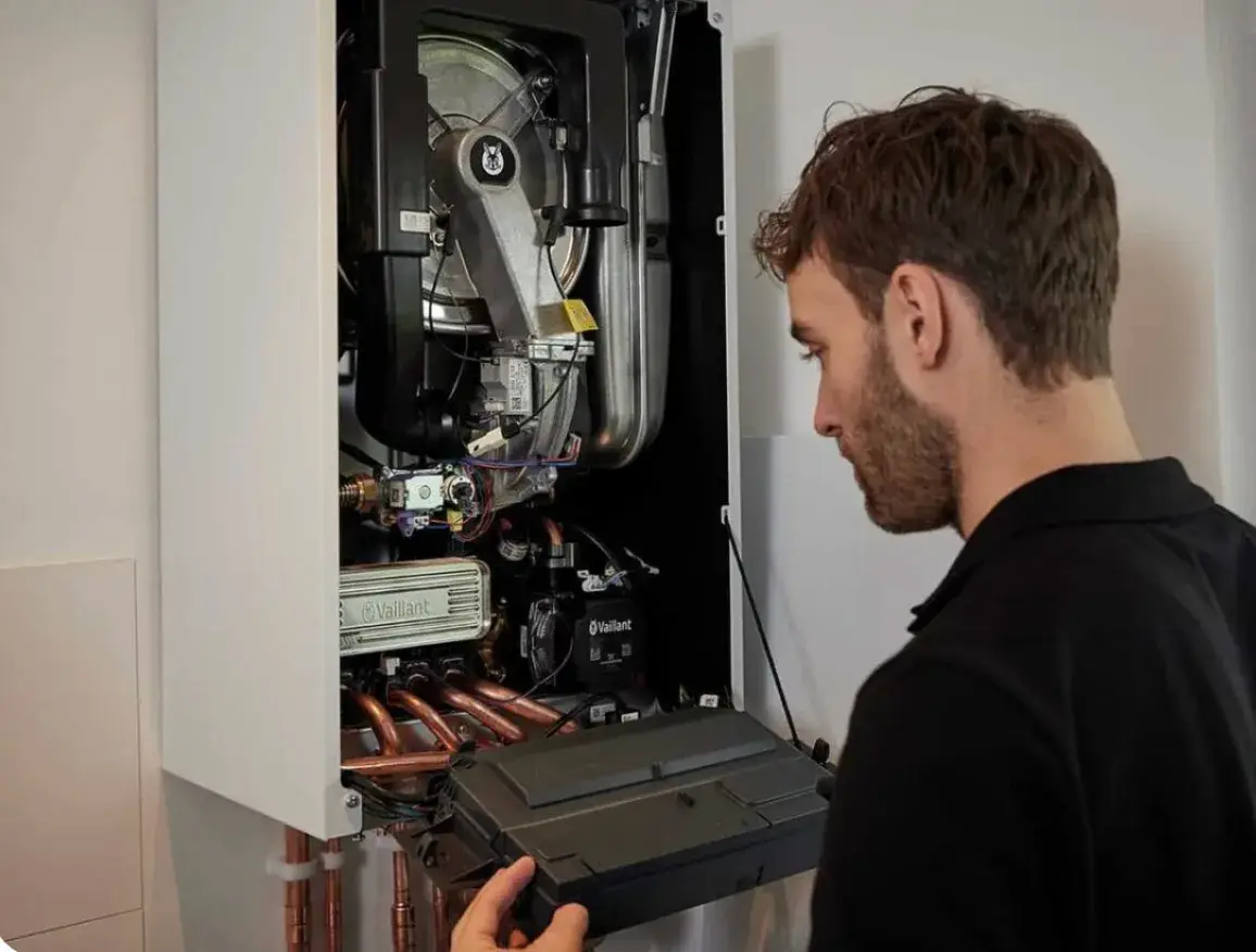 Boiler Repair Hackney Gas safe engineer carrying out boiler repair in North London